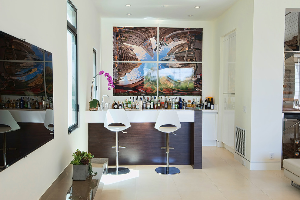 Inspiration for a contemporary seated home bar in Los Angeles with flat-panel cabinets and white cabinets.
