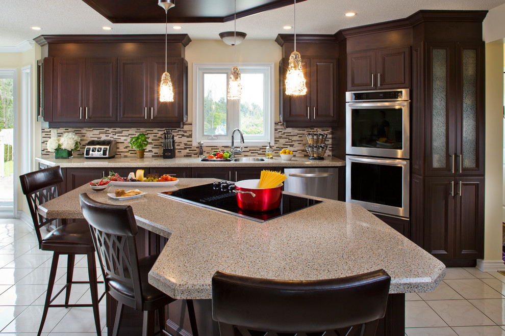 Inspiration for a transitional kitchen remodel in Denver with an island and brown countertops