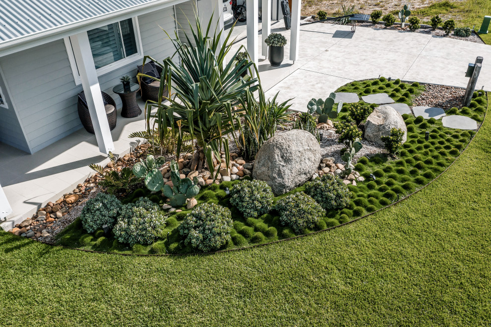 Inspiration for a large contemporary rock and full sun front yard concrete paver driveway in Central Coast.
