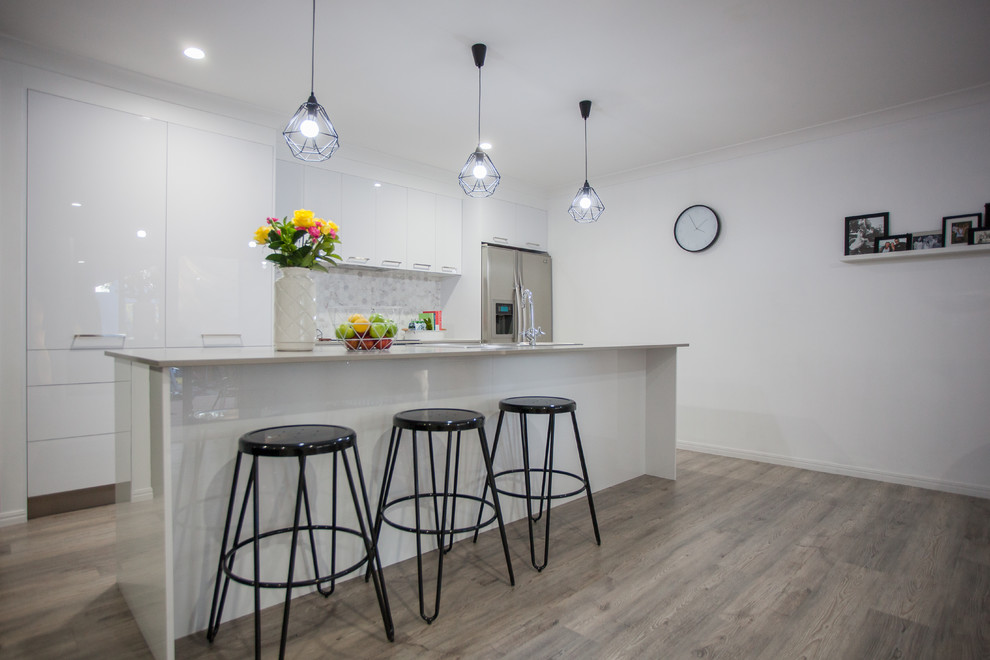Design ideas for a contemporary kitchen in Melbourne with vinyl floors.