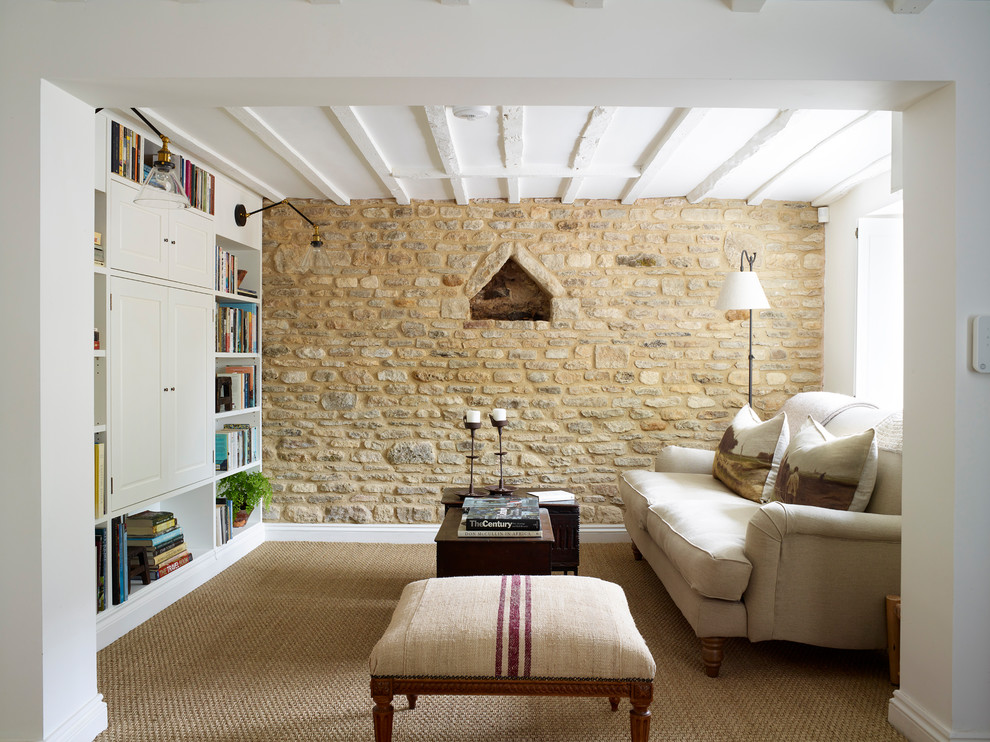Photo of a small country living room in Oxfordshire with white walls, a wood stove and a built-in media wall.
