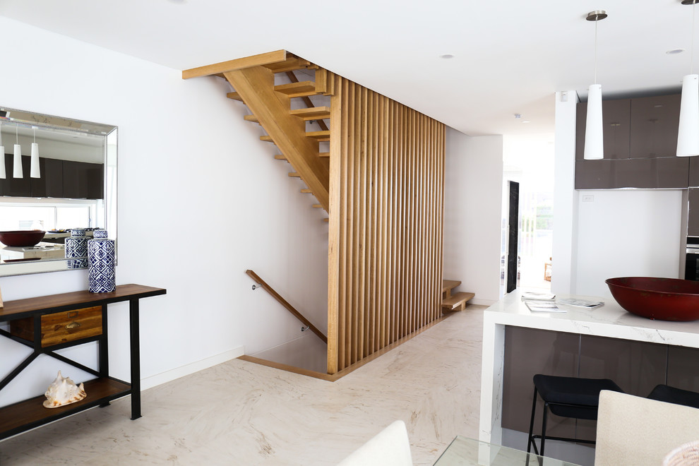 Design ideas for a mid-sized contemporary wood straight staircase in Sydney with open risers and wood railing.