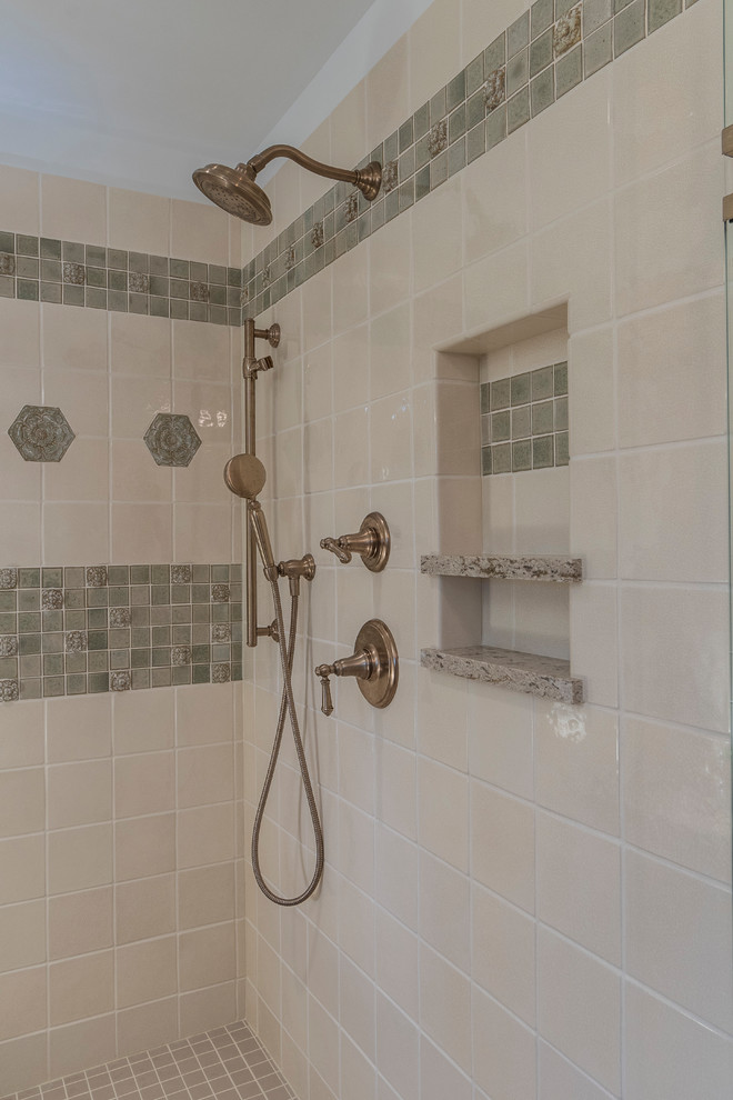 This is an example of a mid-sized traditional master bathroom in Indianapolis with an alcove shower, beige tile, beige walls, ceramic floors, beige floor, a hinged shower door and mosaic tile.