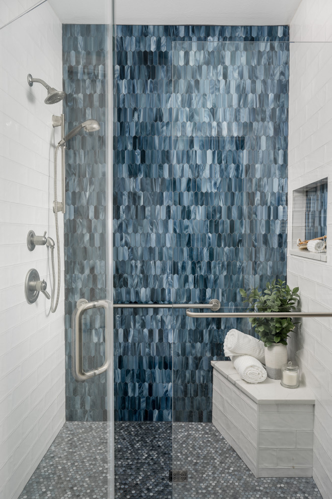 Design ideas for a mid-sized modern master bathroom in Indianapolis with shaker cabinets, black cabinets, a corner tub, a shower/bathtub combo, a one-piece toilet, white tile, white walls, mosaic tile floors, a vessel sink, marble benchtops, white floor, a hinged shower door, white benchtops, a single vanity and a built-in vanity.