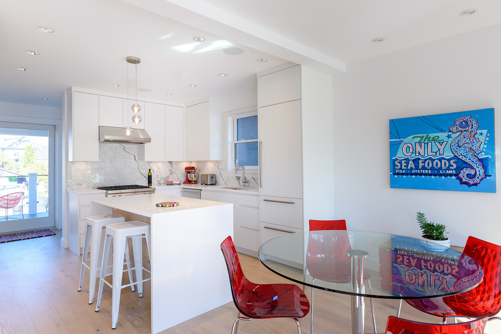 Photo of a small contemporary l-shaped eat-in kitchen in Vancouver with a double-bowl sink, flat-panel cabinets, white cabinets, white splashback, marble splashback, light hardwood floors, with island, white benchtop, panelled appliances, beige floor and quartz benchtops.