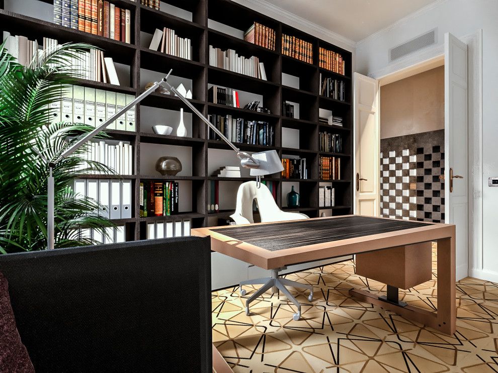 Inspiration for a small contemporary home office in Milan with a library, white walls, light hardwood floors, a freestanding desk and multi-coloured floor.