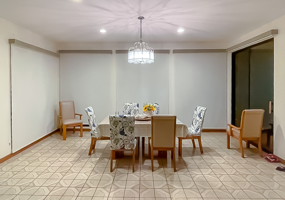 Inspiration for a classic dining room in Los Angeles with ceramic flooring and beige floors.