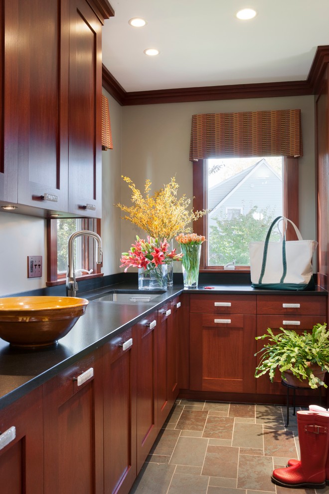 Example of a transitional mudroom design in Boston with beige walls