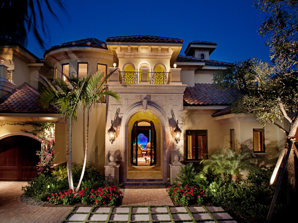 Inspiration for a mediterranean exterior in Miami with stone veneer.