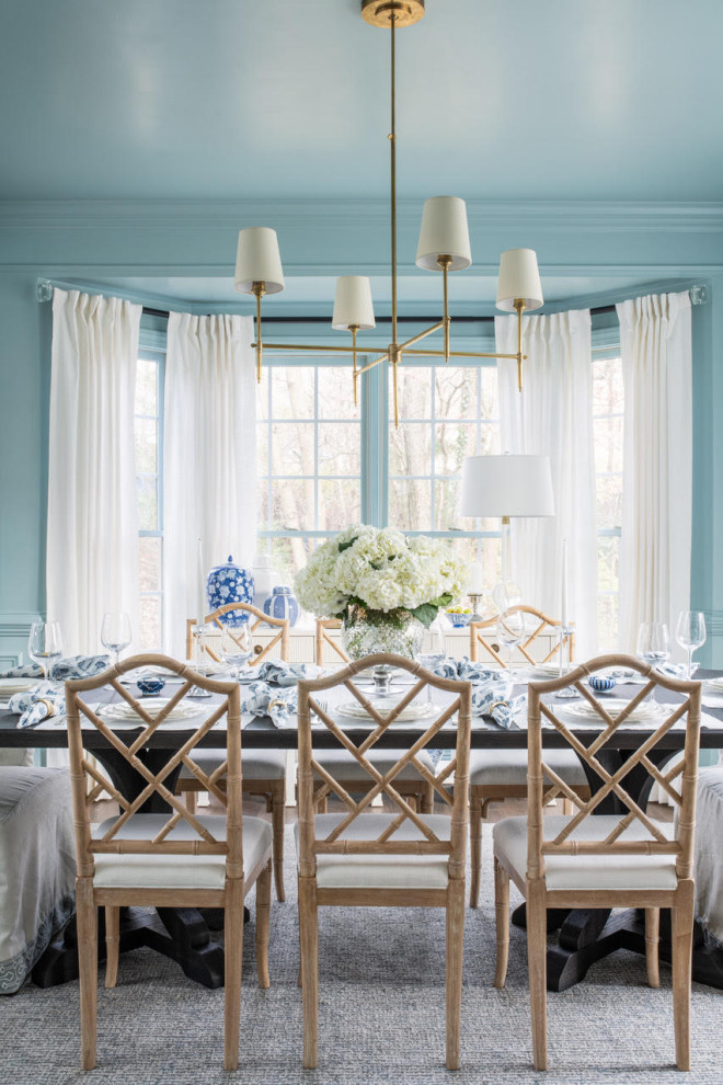 Transitional dining room photo with blue walls