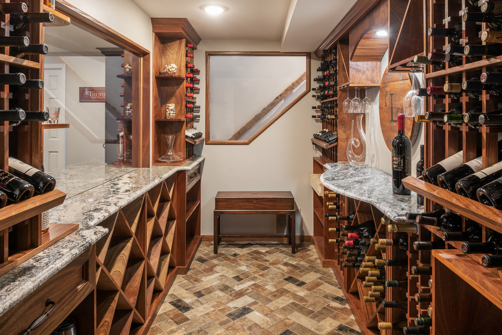 Photo of a mid-sized traditional wine cellar in St Louis with porcelain floors, multi-coloured floor and diamond bins.