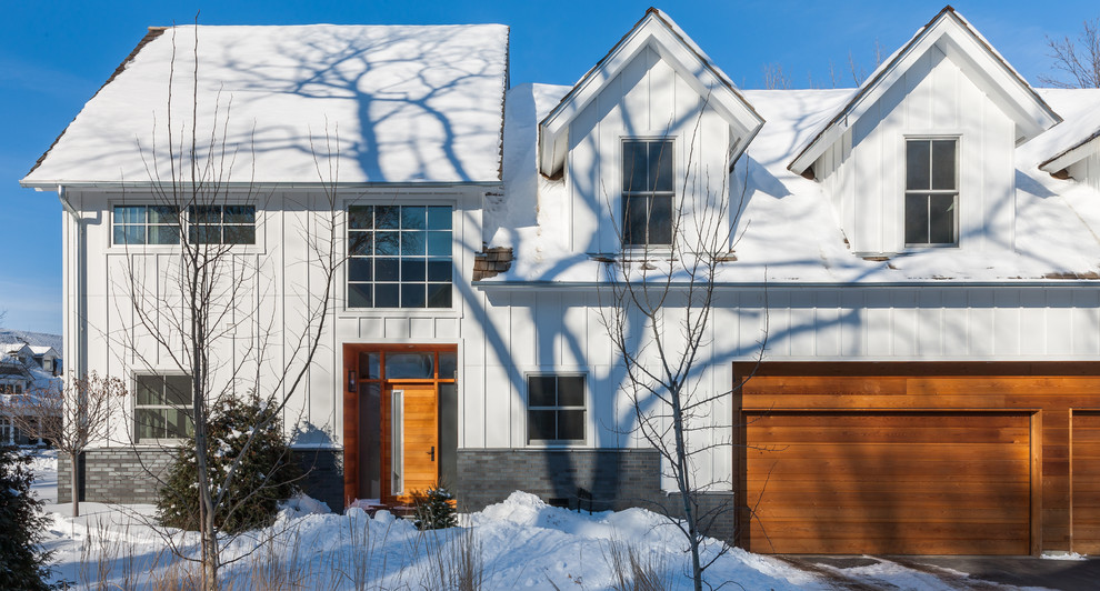 Transitional two-storey white exterior in Minneapolis with concrete fiberboard siding and a gable roof.