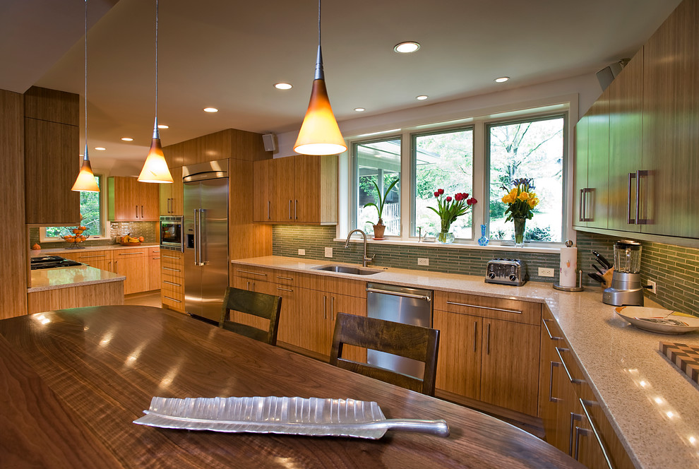 Inspiration for a mid-sized transitional galley concrete floor open concept kitchen remodel in DC Metro with an undermount sink, flat-panel cabinets, green backsplash, stainless steel appliances, no island, quartz countertops and glass sheet backsplash