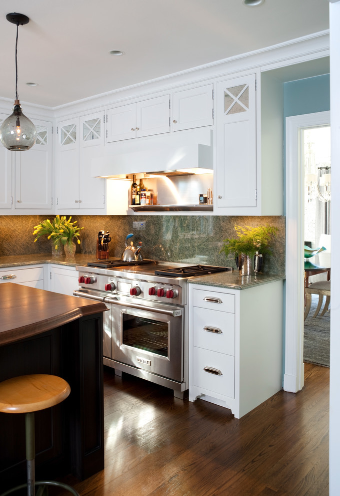 Transitional l-shaped eat-in kitchen photo in DC Metro with a farmhouse sink, shaker cabinets, white cabinets, granite countertops, green backsplash, stone slab backsplash and stainless steel appliances