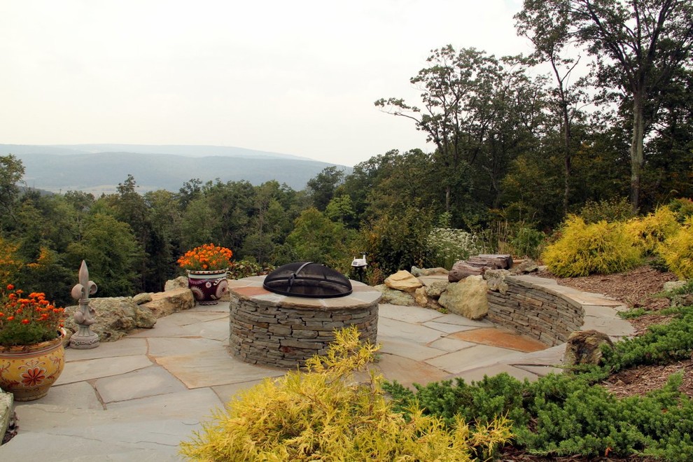 Example of a mid-sized mountain style patio design in DC Metro