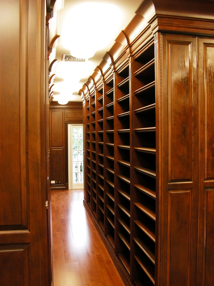 Design ideas for an expansive traditional walk-in wardrobe in Miami.