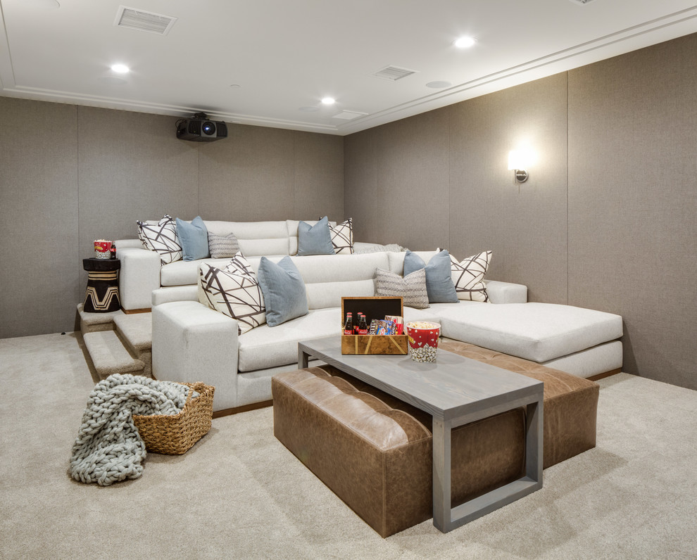 Inspiration for a mid-sized transitional enclosed home theatre in Orange County with beige walls, carpet and beige floor.