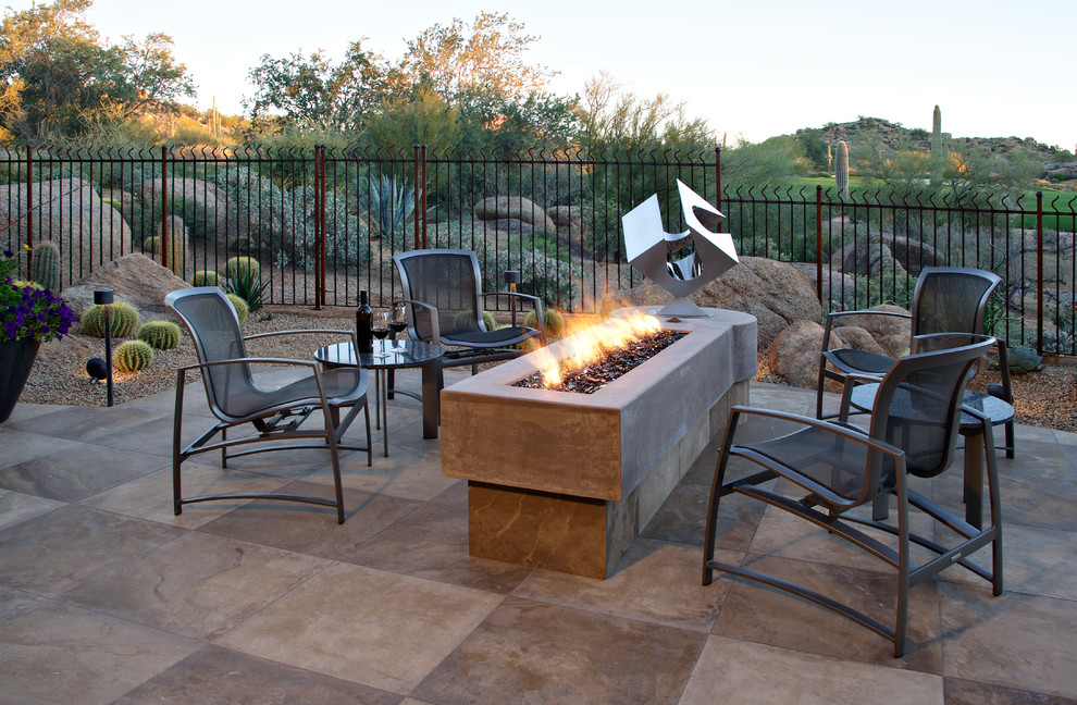 Inspiration for a large modern backyard patio in Phoenix with a fire feature, tile and no cover.
