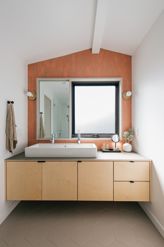 Design ideas for a small master bathroom in Orange County with flat-panel cabinets, light wood cabinets, ceramic tile, white walls, porcelain floors, wood benchtops, grey floor, grey benchtops, orange tile, a trough sink, a double vanity and a floating vanity.