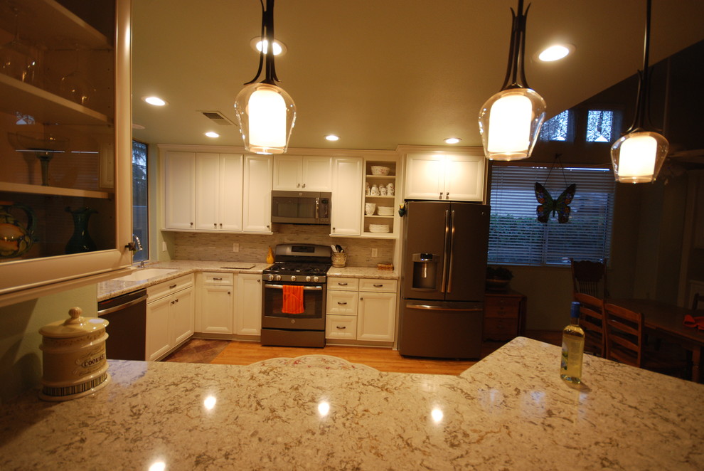 Inspiration for a transitional kitchen remodel with flat-panel cabinets and white cabinets