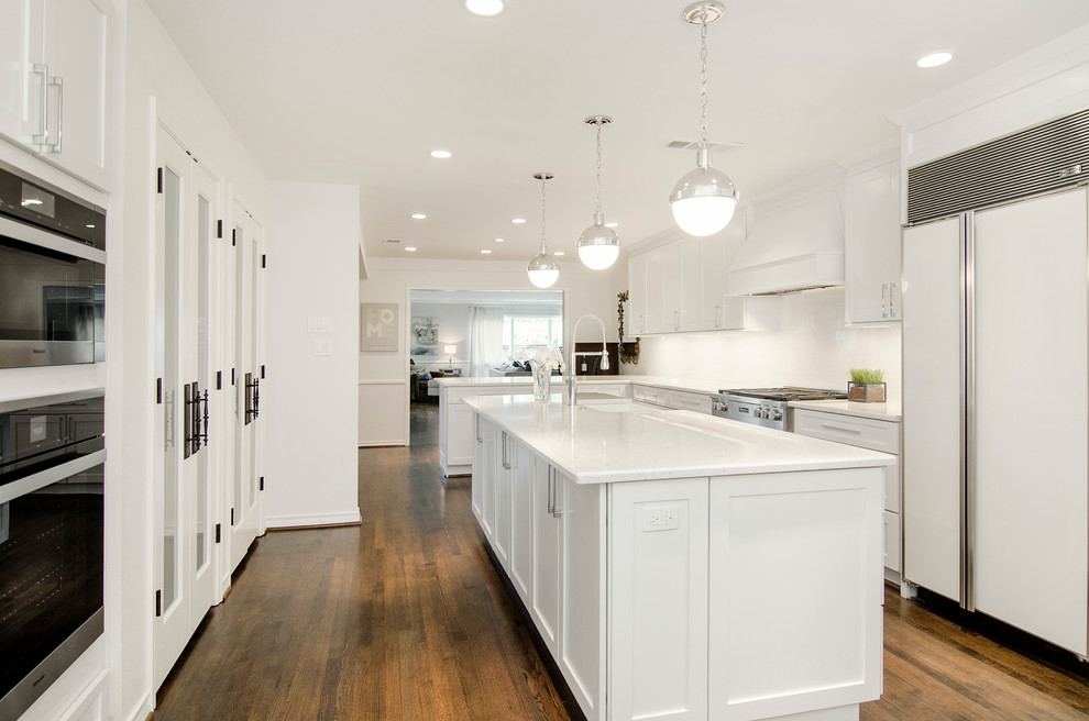 Mid-sized transitional u-shaped medium tone wood floor kitchen pantry photo in Dallas with a farmhouse sink, open cabinets, white cabinets, solid surface countertops, white backsplash, subway tile backsplash, stainless steel appliances and an island