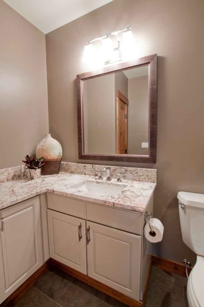 Mid-sized transitional 3/4 bathroom in Denver with raised-panel cabinets, grey cabinets, an alcove shower, gray tile, porcelain tile, brown walls, porcelain floors, an undermount sink and granite benchtops.