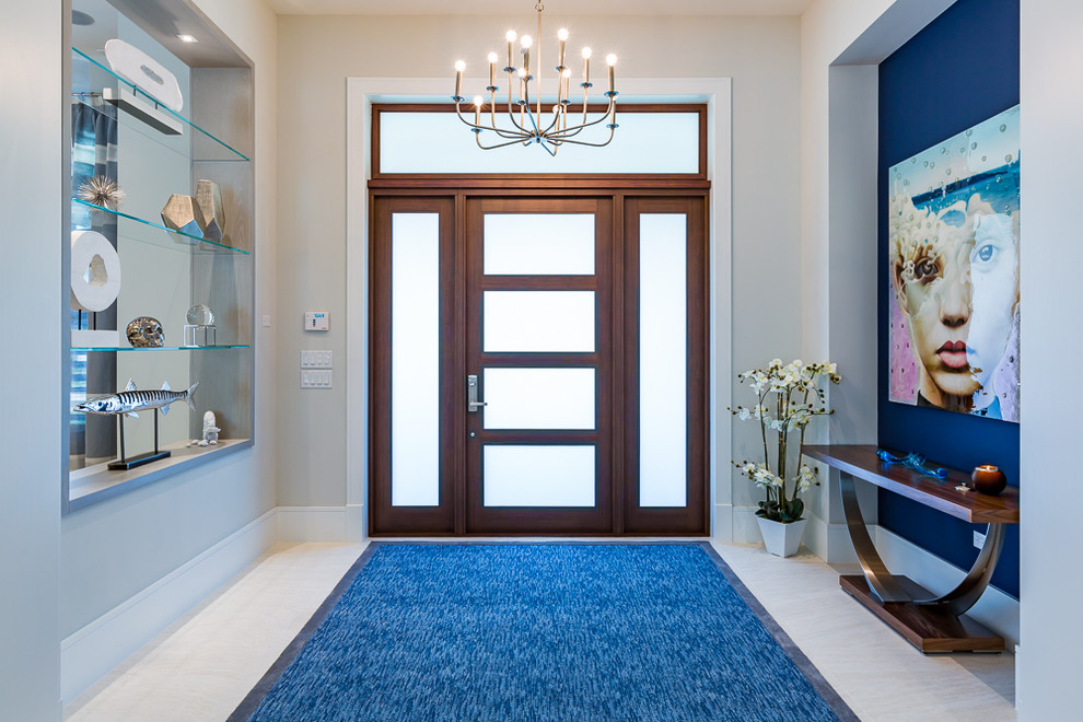 Design ideas for a large contemporary foyer in Miami with grey walls, porcelain floors, a single front door, a glass front door and white floor.