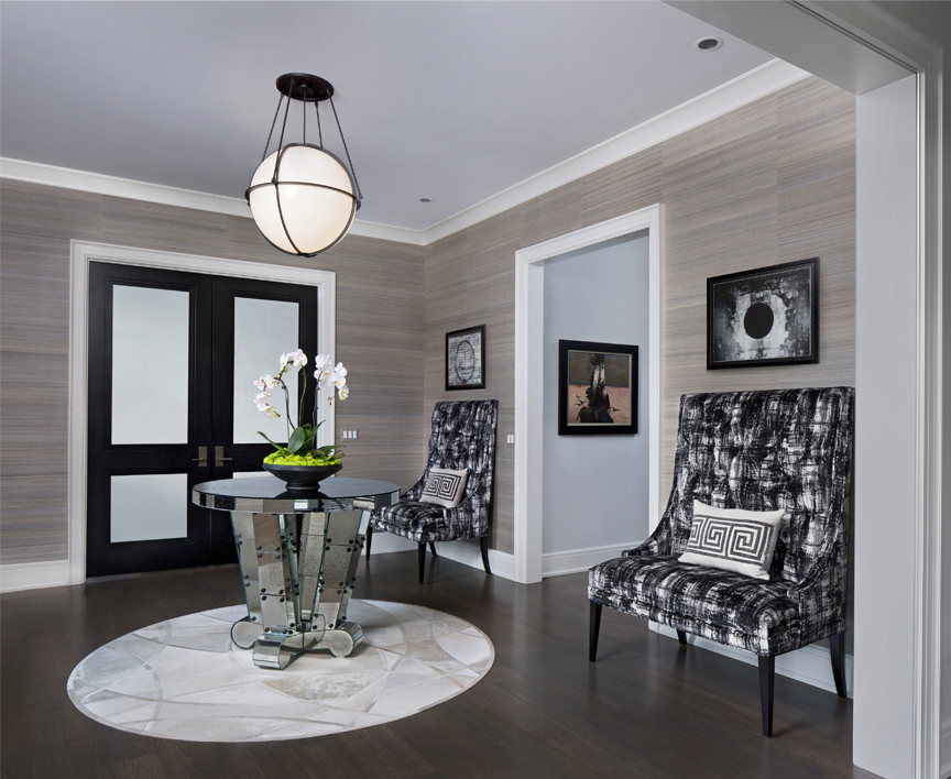 Inspiration for a mid-sized contemporary foyer in Detroit with multi-coloured walls and medium hardwood floors.