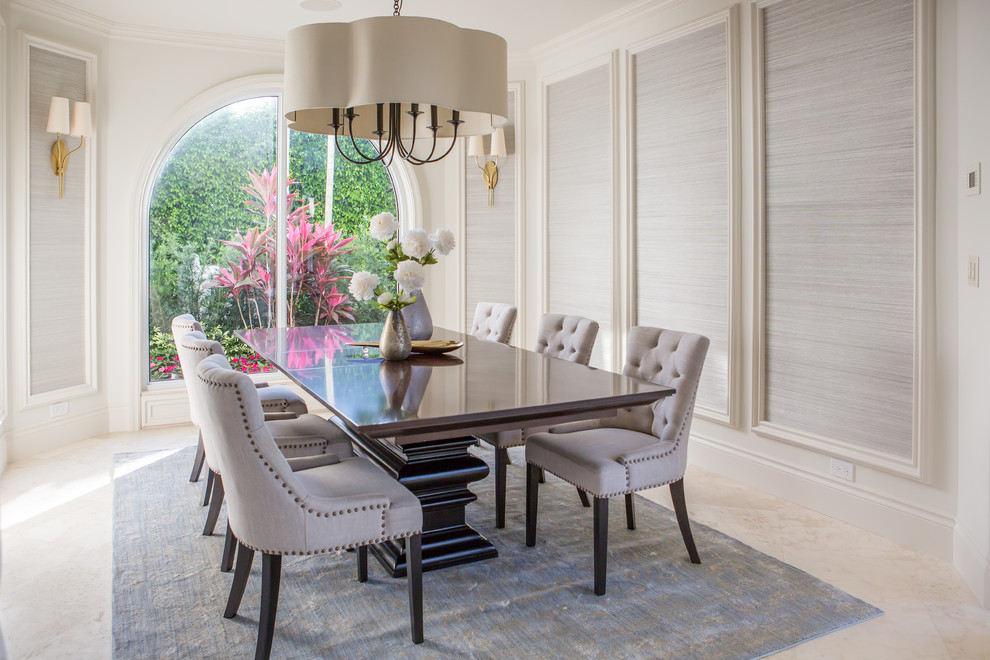 Inspiration for a transitional dining room in Miami with white walls and white floor.