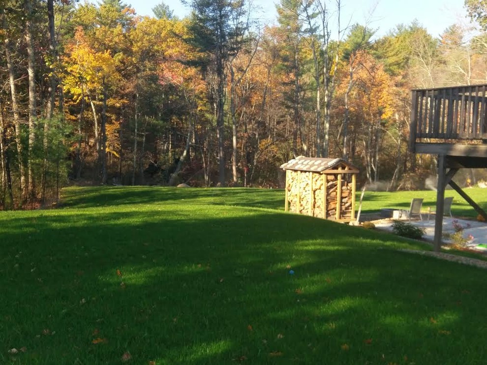 Design ideas for a large rustic partial sun backyard landscaping in Boston.