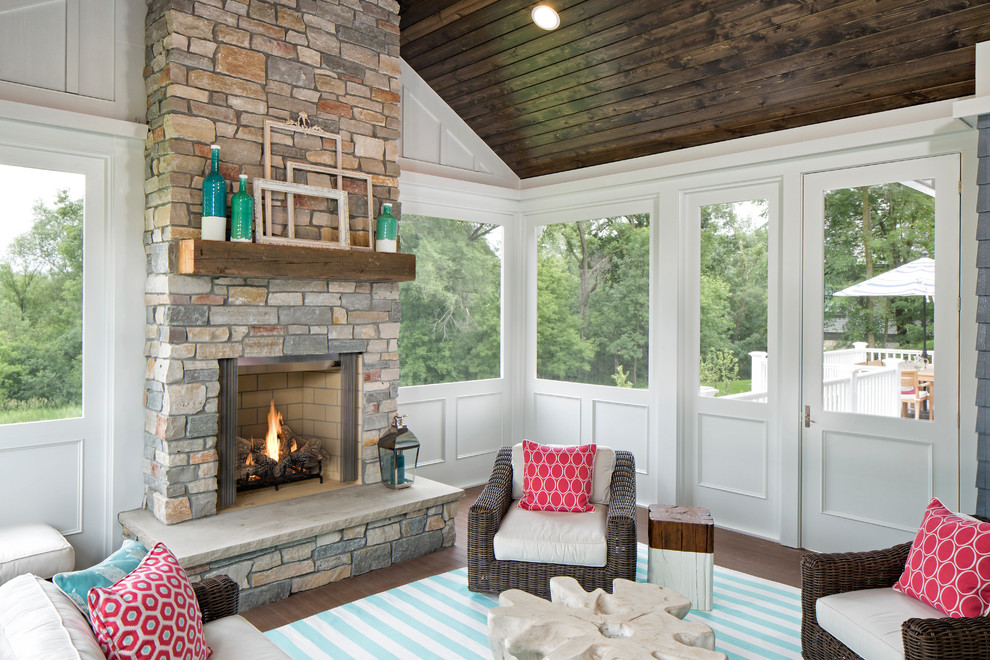 Inspiration for a transitional sunroom in Minneapolis with a standard fireplace, dark hardwood floors, a standard ceiling and a stone fireplace surround.