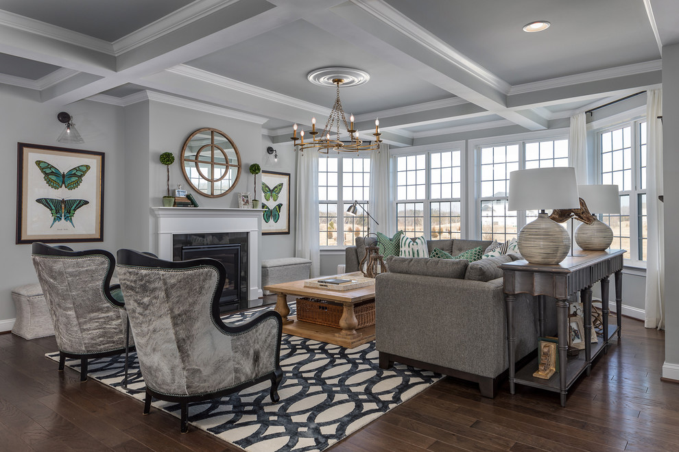 This is an example of a transitional open concept living room in DC Metro with grey walls, dark hardwood floors, a standard fireplace and brown floor.