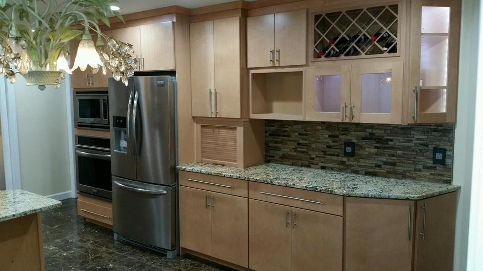Inspiration for a huge transitional u-shaped marble floor eat-in kitchen remodel in Newark with an undermount sink, flat-panel cabinets, light wood cabinets, granite countertops, brown backsplash, mosaic tile backsplash and stainless steel appliances