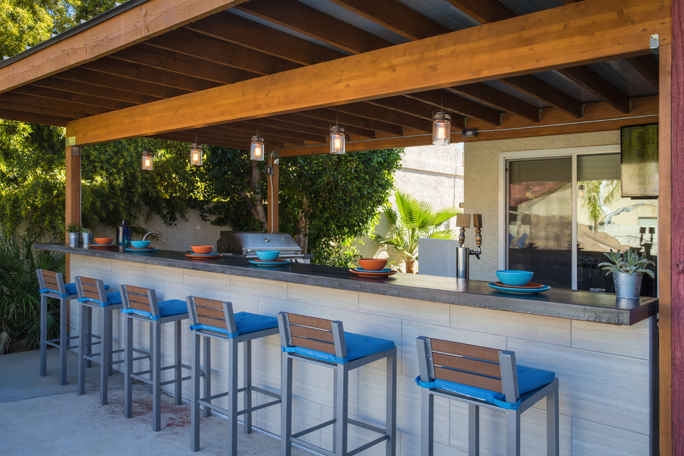 Design ideas for a large transitional backyard patio in Phoenix with an outdoor kitchen, tile and a pergola.