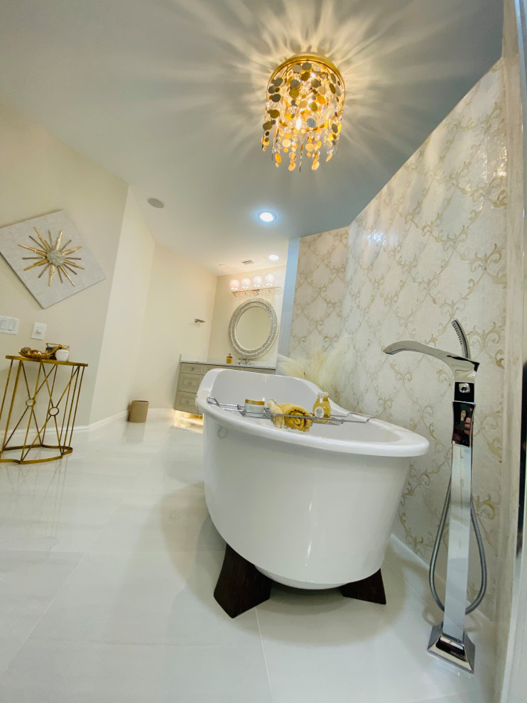 Inspiration for a large modern master bathroom in Tampa with recessed-panel cabinets, beige cabinets, a freestanding tub, a double shower, a bidet, gray tile, marble, grey walls, marble floors, an undermount sink, marble benchtops, an open shower, white benchtops, a niche, a double vanity and a built-in vanity.