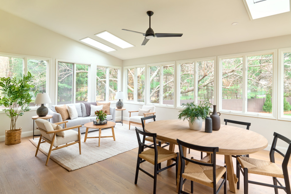 Inspiration for a large beach style sunroom in New York with a skylight and medium hardwood floors.