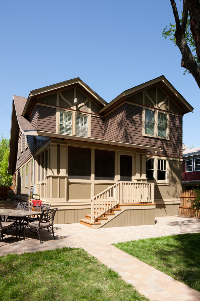 Design ideas for a mid-sized traditional two-storey brown exterior in Kansas City with mixed siding.