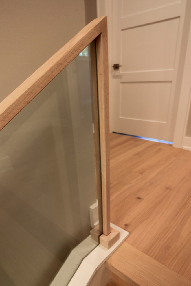 Inspiration for a small contemporary wooden straight glass railing staircase remodel in DC Metro with wooden risers