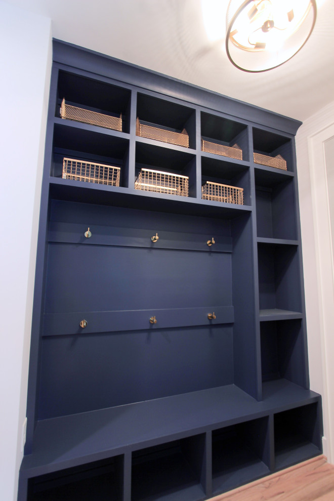 The Cardinal - Inspiration for a mid-sized contemporary light wood floor mudroom remodel in Richmond with blue walls