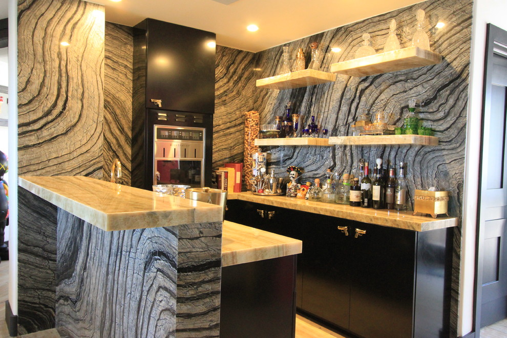 Design ideas for an expansive eclectic l-shaped home bar in Orange County with an undermount sink, flat-panel cabinets, grey cabinets, marble benchtops, white splashback, subway tile splashback and ceramic floors.