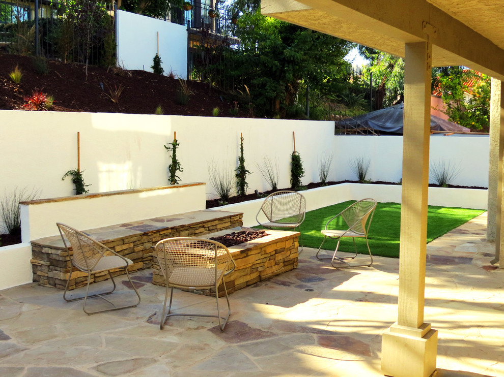 Patio - mid-sized transitional backyard concrete patio idea in Orange County with a fire pit and no cover