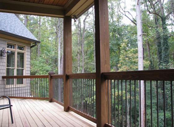 Design ideas for a mid-sized transitional backyard deck in Atlanta with a roof extension.