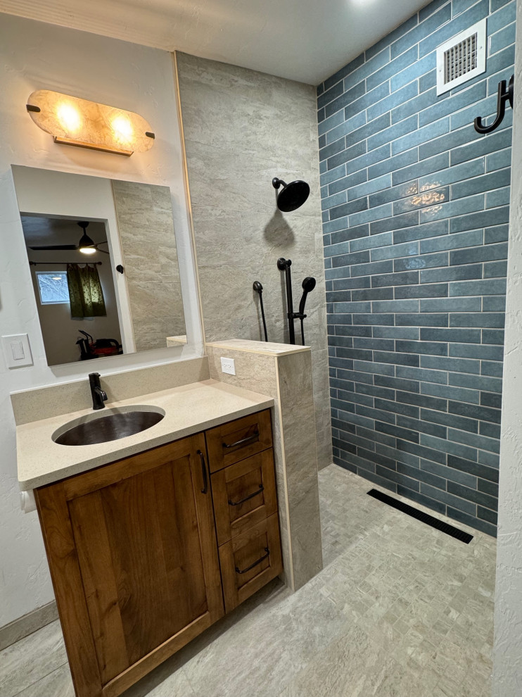 Walk-in shower - mid-sized transitional master blue tile and porcelain tile porcelain tile, beige floor and single-sink walk-in shower idea in Phoenix with shaker cabinets, medium tone wood cabinets, a bidet, white walls, an undermount sink, quartz countertops, beige countertops and a built-in vanity