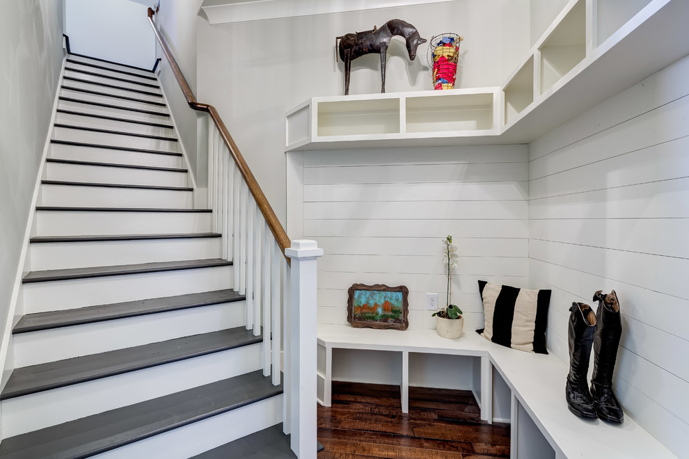 Inspiration for a transitional mudroom in Atlanta with white walls and dark hardwood floors.