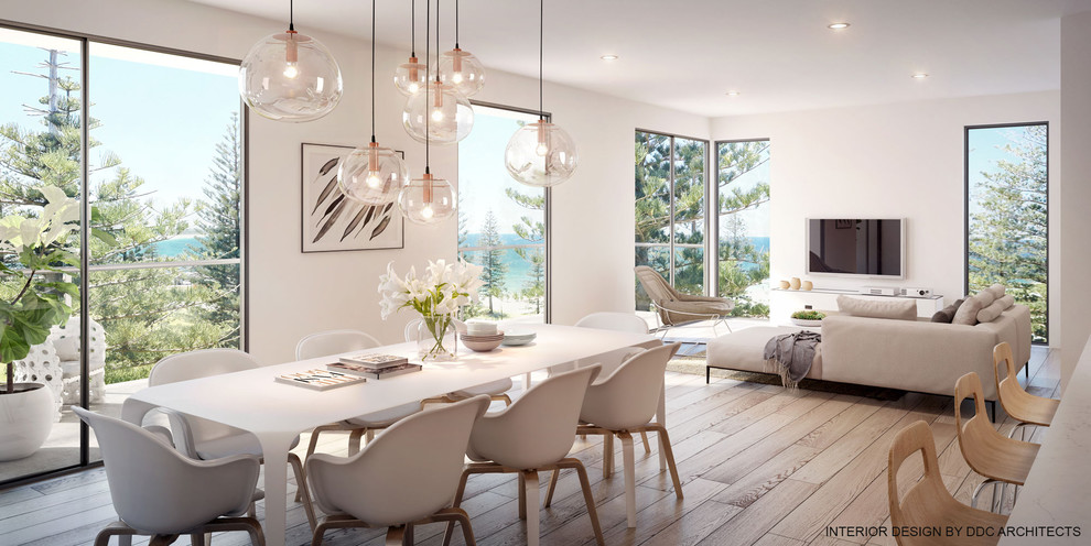 Design ideas for a large scandinavian dining room in Sydney with white walls, light hardwood floors and multi-coloured floor.
