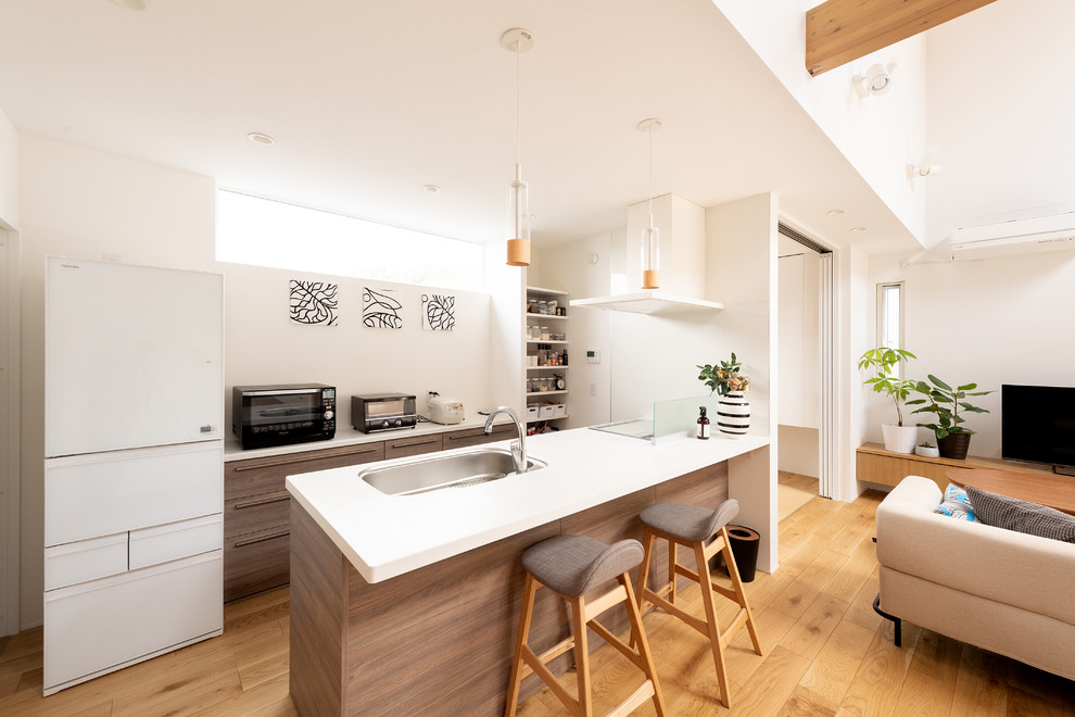 Photo of a modern kitchen in Kyoto with beige floor and white benchtop.