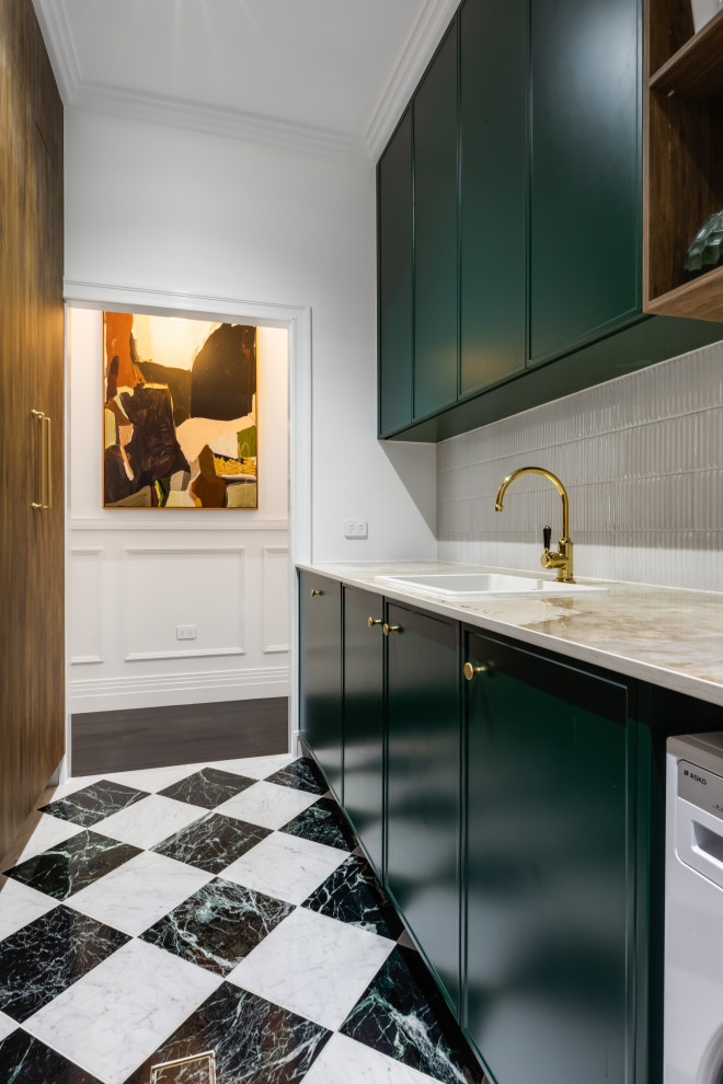 Design ideas for a midcentury galley separated utility room in Brisbane with a built-in sink, shaker cabinets, green cabinets, composite countertops, white splashback, matchstick tiled splashback, white walls, marble flooring, a side by side washer and dryer and multi-coloured floors.