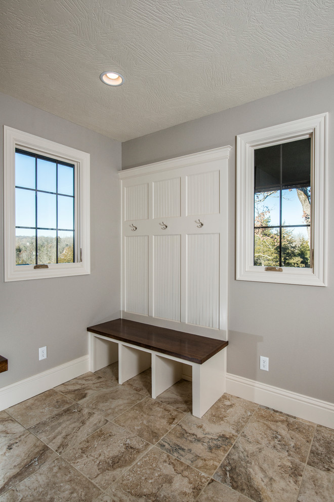 Mid-sized elegant ceramic tile mudroom photo with gray walls