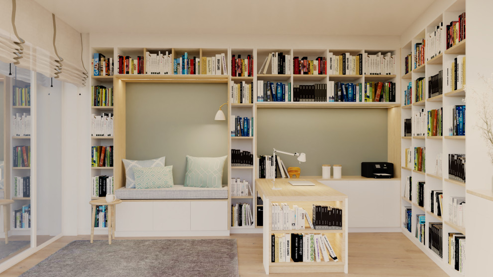 Ispirazione per un grande studio nordico con libreria, pareti verdi, pavimento in legno massello medio e scrivania incassata