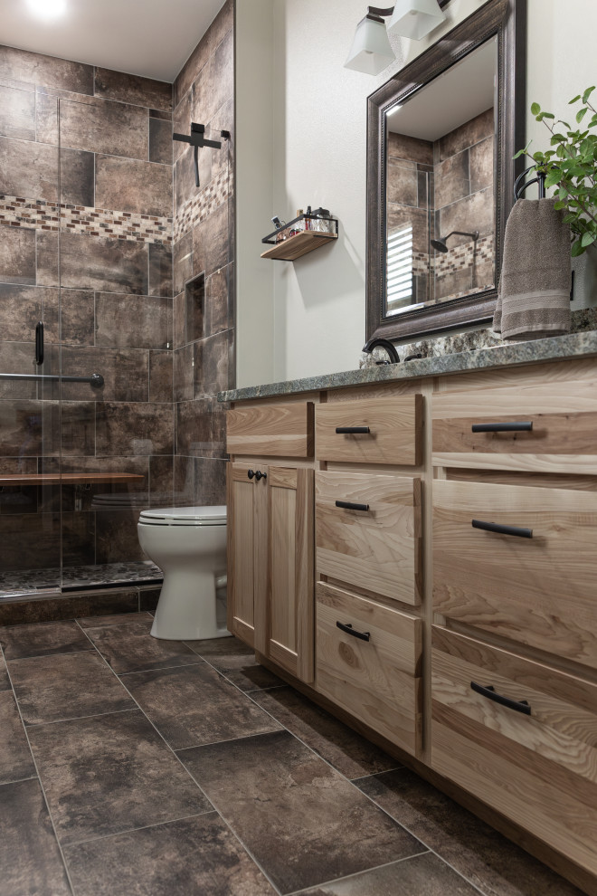 Large midcentury ensuite bathroom in Portland with flat-panel cabinets, light wood cabinets, brown tiles, a submerged sink, granite worktops, brown floors, brown worktops, double sinks and a built in vanity unit.